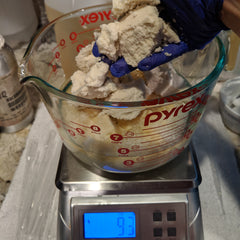 Measuring out shea butter for lip balm