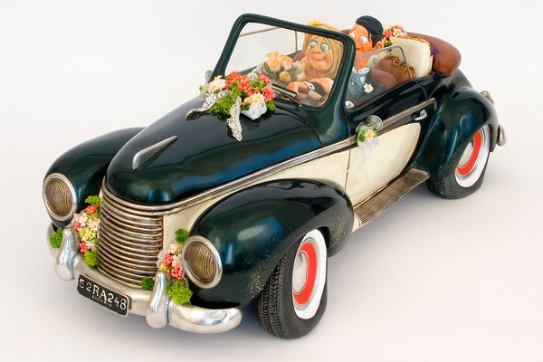 Guillermo Forchino sculpture of a car carrying a 'Just Married' couple