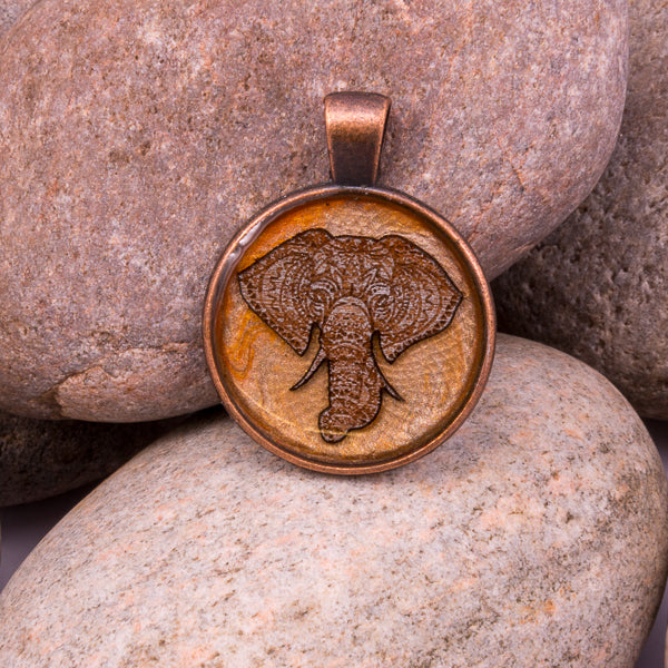 Handcrafted Bespoke Majestic Elephant Pendant; set in copper effect metal bezel.| Jabbawocky Crafts (jabbawockycrafts.co.uk)