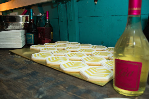 Sparkling wine and logo cookies ready to go.