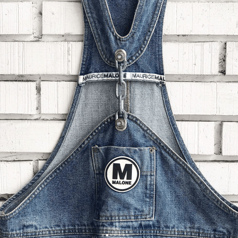 @eat_gifu close-up of vintage chain-link denim overalls by Maurice Malone with circle logo