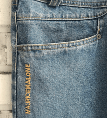 Maurice Malone branding at the hip of jeans were a brand trademark in the early 90's
