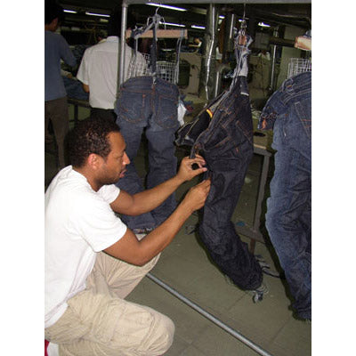 Innovative black denim designer Maurice Malone working during the early days of developing a better way to produce textured denim whiskers for mass production manufacturing.