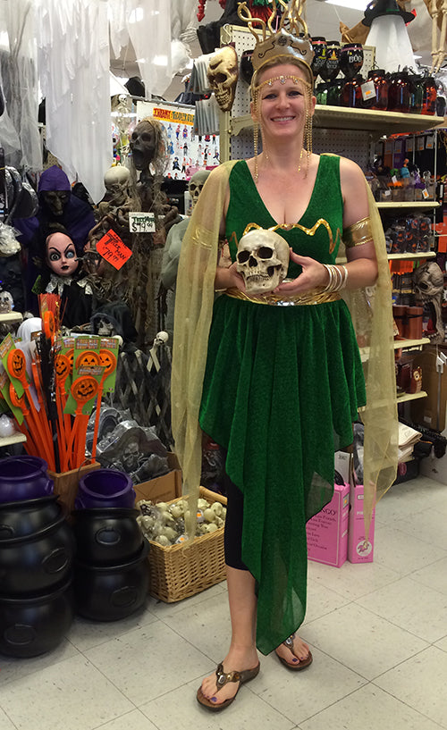 Store owner wears comfortable sandals by Vionic as part of her Greek inspired Halloween costume