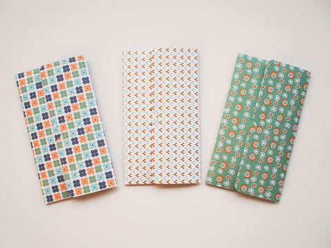 Pastel Nordic design money envelopes in blue and coral shades
