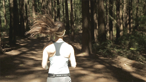 girl running in woods