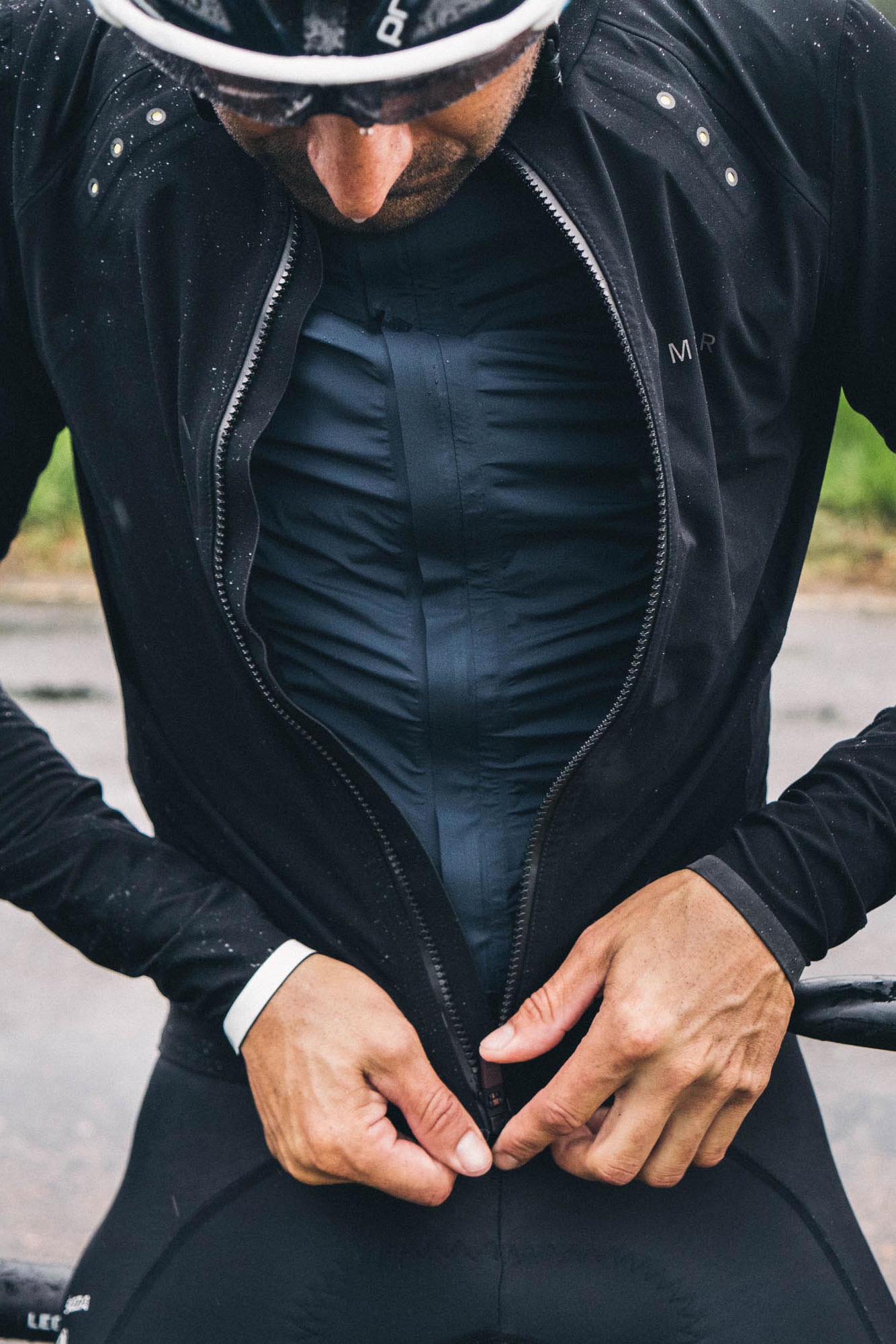 Kristian wears the Metier Rain Jacket