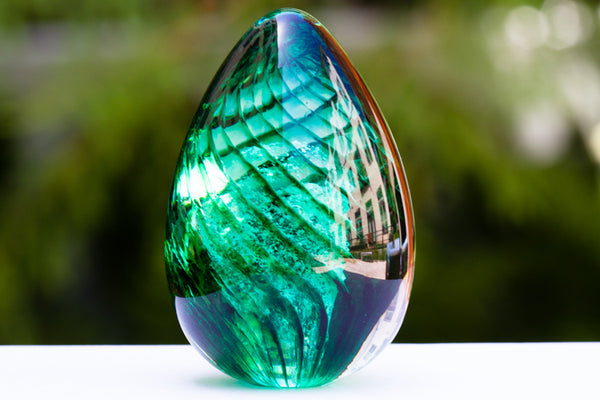 green glass cremation urn