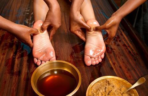 feet recieving thai reflexology massage