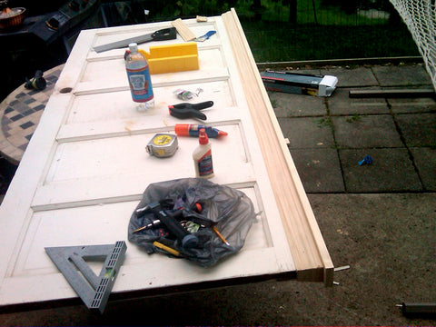 tools on shaker style door being turned into headboard