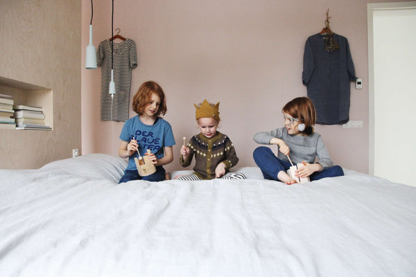 Tessa Hop's boys playing Auris musical instruments