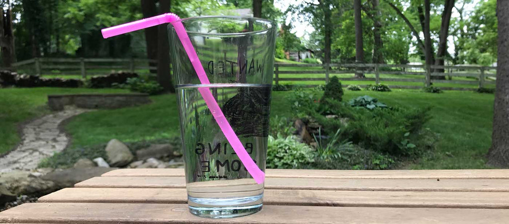 A drinking straw is magnified by refraction