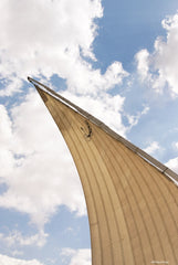 Dahabeya sail under a blue cloudy sky