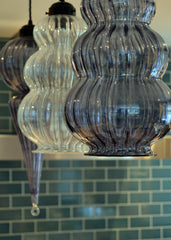 Handmade colourful glass lights above the kitchen counter