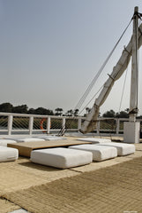 Rustic seating area under the sails