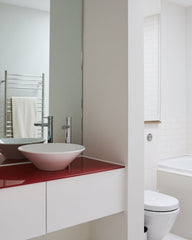 Teenager's bathroom with a splash of red