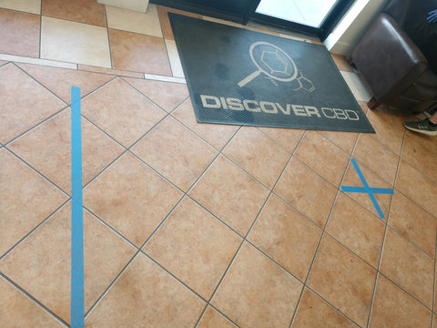Blue lines on store floor to represent safe distance