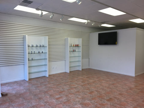 Inside of store building with tv and shelving