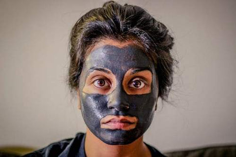 woman wearing cosmetic mask on face