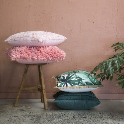 Tropical escape style guide pillows and stool lifestyle shot