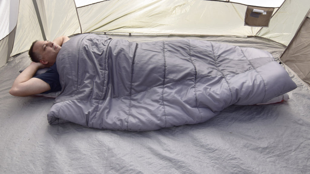 Adventure Top Quilt being used as a Sleeping Bag In a camping tent (photo)
