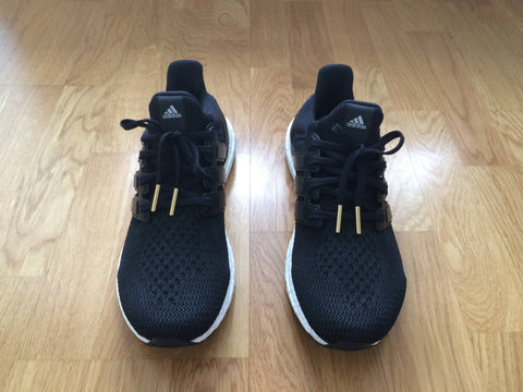 ultra boost core black 2.0 bullet tips gold