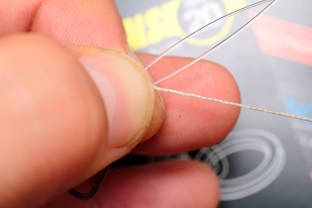 How to tie a combi rig: pull the braid right the way through the doubled over section of fluorocarbon