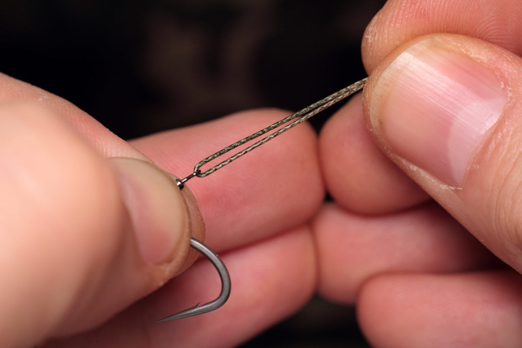 double over a short length of coated braid or nylon in the micro hook ring swivel