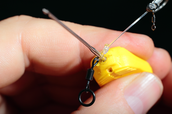 Using your baiting needle of similar open up the loop attaching the rig to the eye of the swivel