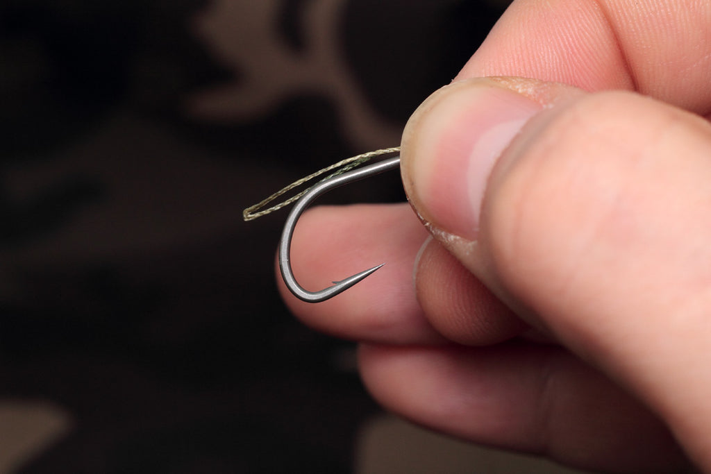 make sure you pass enough of the doubled over section through so it will pass over the bend of the hook