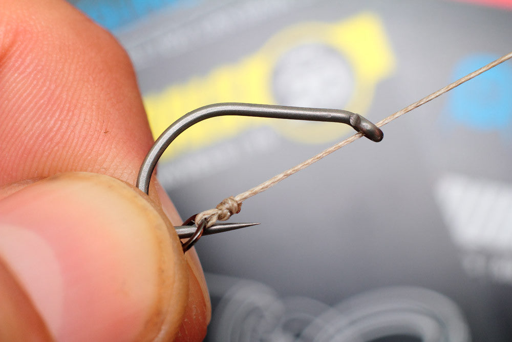 feed the micro hook ring swivel onto the hook,over the point and round to the bend of the hooks
