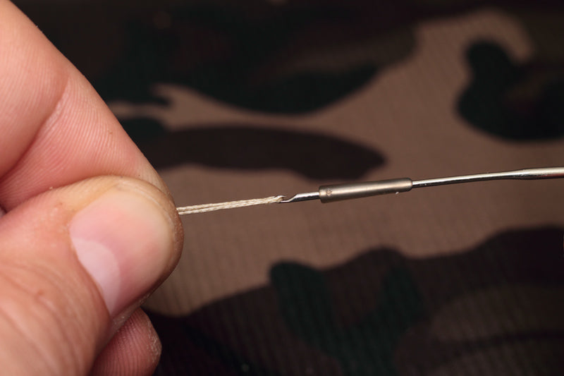 Load the line aligner onto a baiting needle