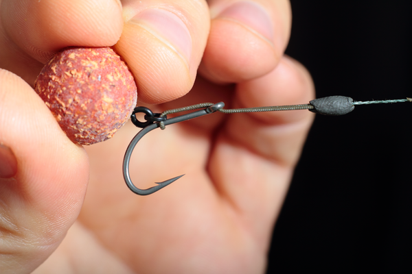 Pull the loop back through the eye of the Chod hook until it's around halfway down the shank
