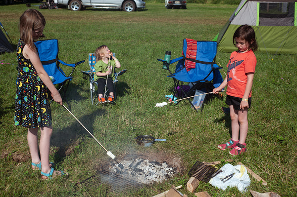 family camping at oshkosh with fire pit