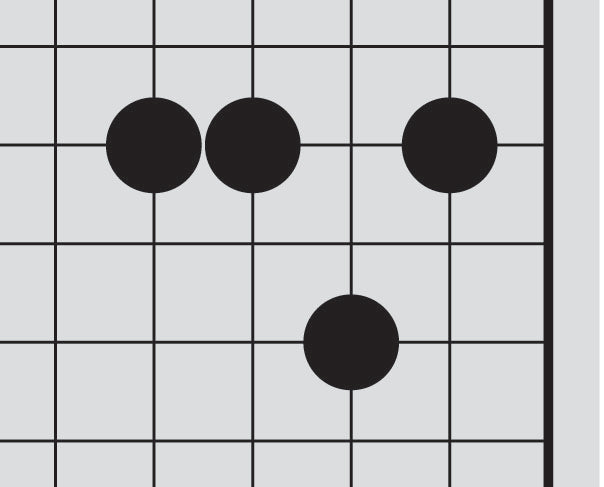 Dia. 11 - A portion of a Go board with 4 black stones