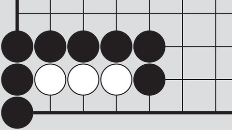Dia. 1 - A portion of a Go board with 8 black stones and 3 white stones