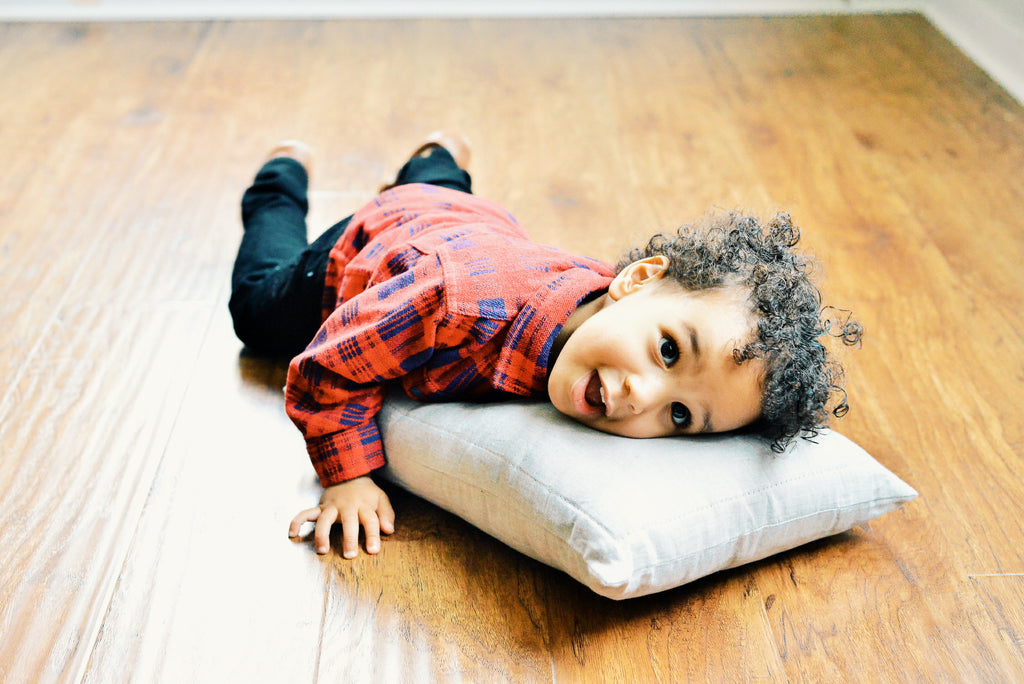 2 year old toddler Kingsley getting his first toddler pillow by Wholesome Linen