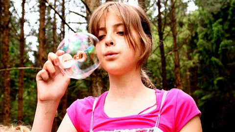 girl-blowing-bubbles