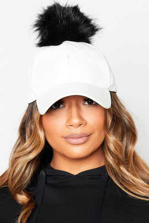 White Pu Baseball Cap with Black Pom Poms