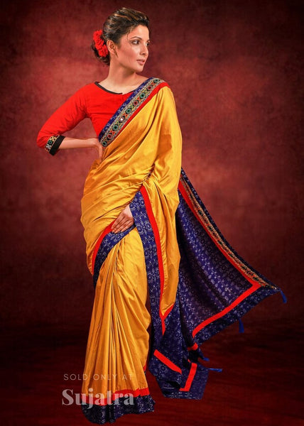 Mustard semi silk saree with sambalpuri ikat pallu & kutch mirror work border