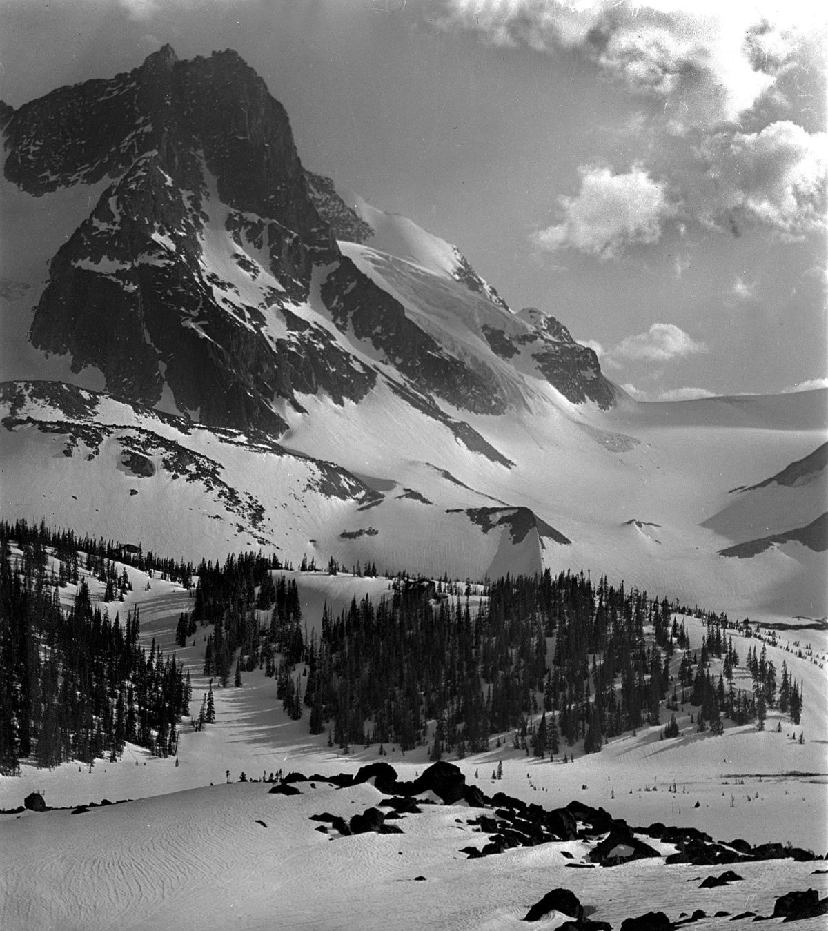 Snow-covered mountain peak in striking black and white.