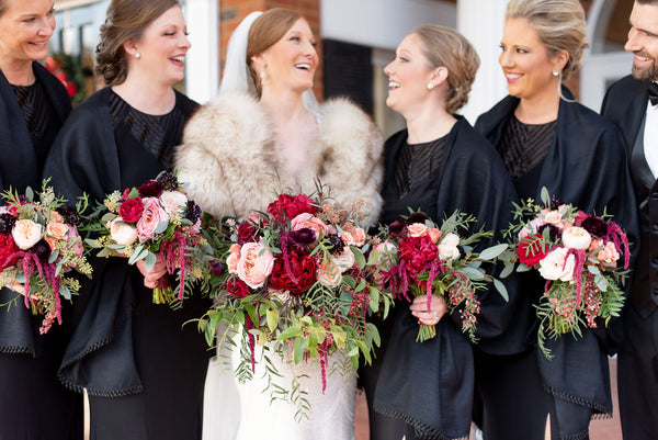 winter wedding bridesmaids black dresses greenery and burgundy flowers