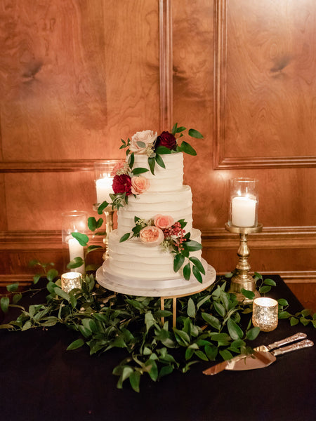 wedding cake with greenery and pink english roses