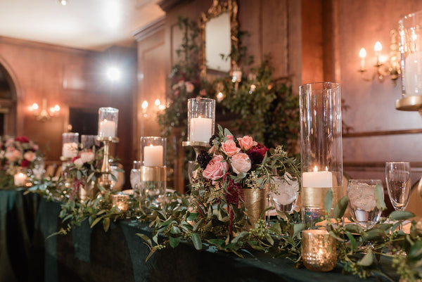 winter wedding greenery green velvet gold candles