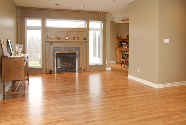 antique maple wood flooring with a fireplace 