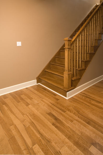 close up picture of birdseye maple flooring showing the character