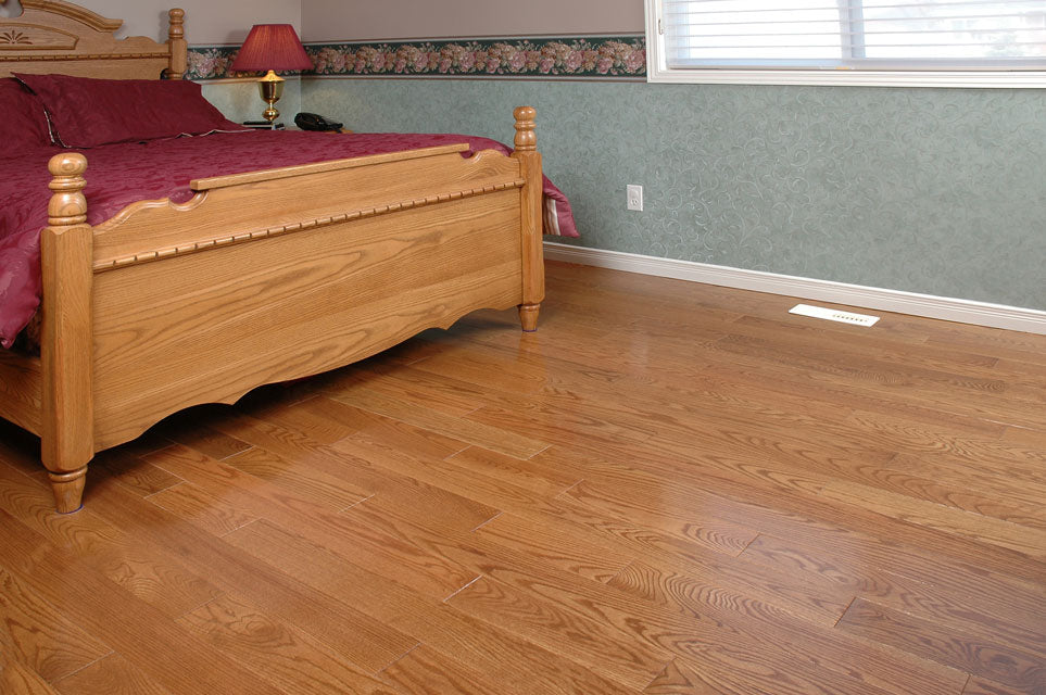 light stained red oak hardwood flooring in a bedroom