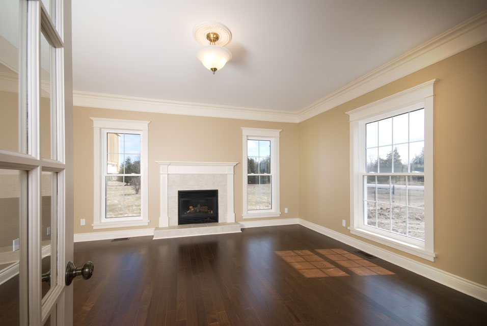 dark oak flooring with a white fireplace