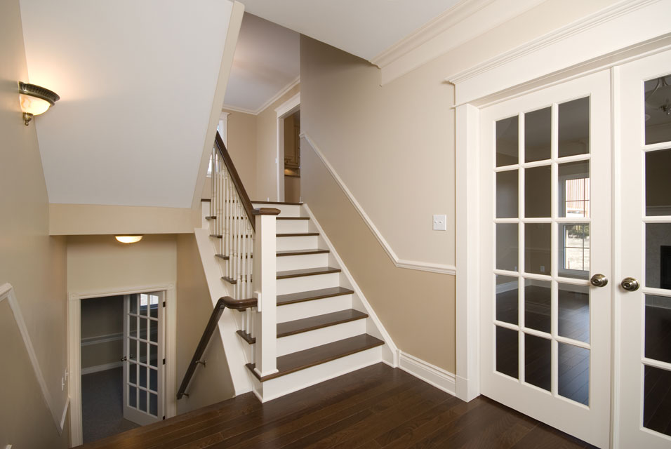 dark flooring on stairs with white risers