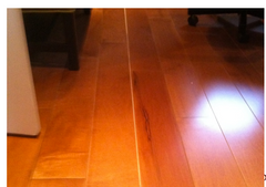 Spacing between wood flooring boards